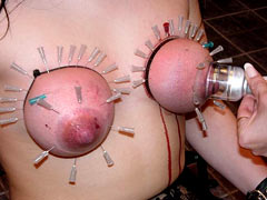 Amateur masochist woman suspendes herself by her tits at home